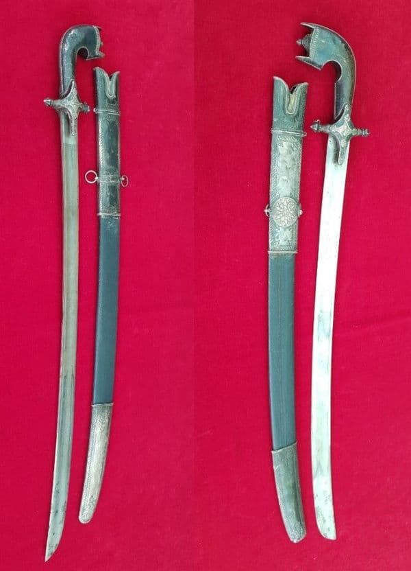 A fine Silver mounted Arab sword Saif or Nimcha in silver mtd scabbard. Good condition. Ref 2619